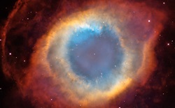 Nebula that has a blue core with rings of orange and red around it