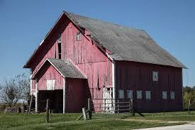 A faded red and decaying barn